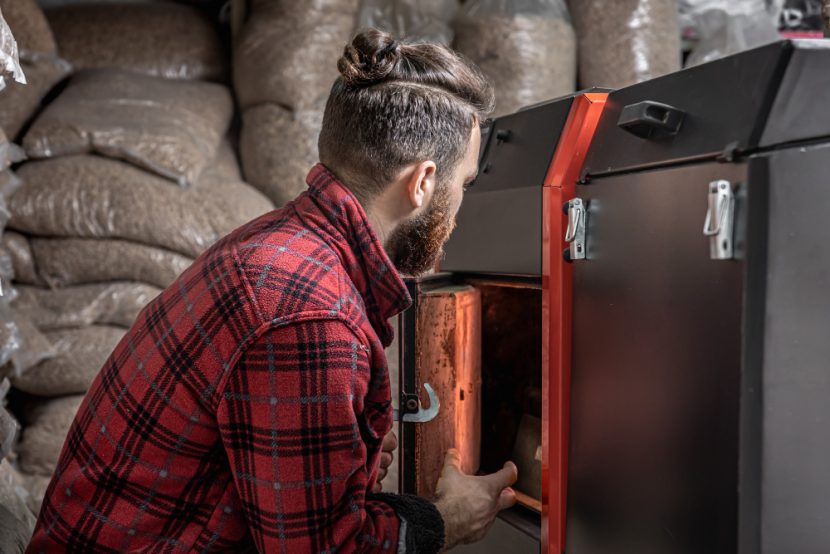 a worker using a solid fuel boiler in Malaysia